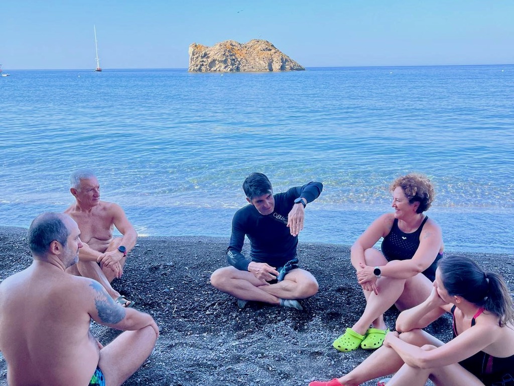 Coach Baha briefing swimmers in Skala Eresos